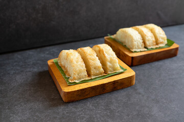 Kue Pancong, Gandos or Bandros is Indonesian traditional snack. This cake is a traditional food from the Betawi people. It is made from a mixture of rice flour, grated coconut, sugar, and coconut milk