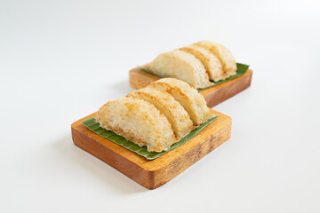 Kue Pancong, Gandos or Bandros is Indonesian traditional snack. This cake is a traditional food from the Betawi people. It is made from a mixture of rice flour, grated coconut, sugar, and coconut milk