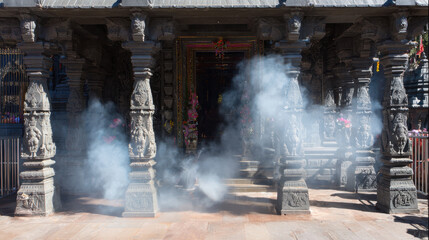 Incense smoke fills a temple portico.