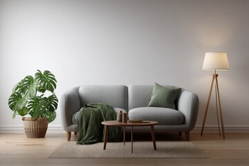a Scandinavian living room wall mockup with a small round wooden coffee table in front of a light gray sofa, green throw blanket on the sofa, indoor monstera plant in a basket on the left