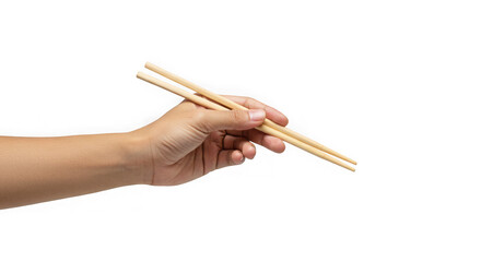 A hand holds a pair of wooden chopsticks  isolated on transparent background