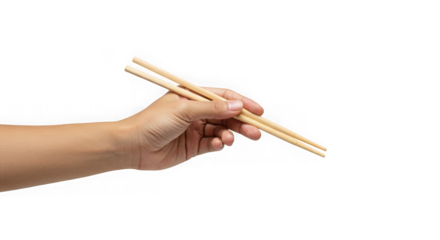 A hand holds a pair of wooden chopsticks  isolated on transparent background