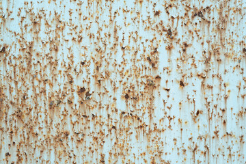 Rust spots and streaks on metal wal