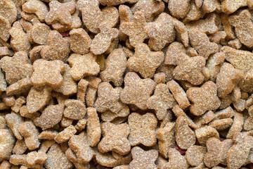 The texture of brown dry pet food. Dry cat food.
