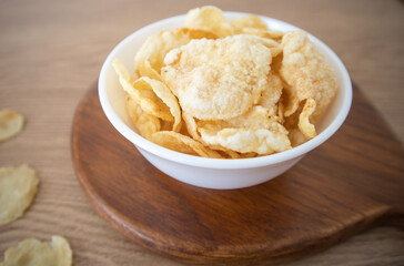 Emping is a type of Indonesian chip, a bite-size snack kripik cracker, made of melinjo or belinjo (Gnetum gnemon) nuts. Emping crackers have a slightly bitter taste