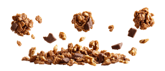 Chocolate-covered granola pieces in mid-air, scattered on a dark background