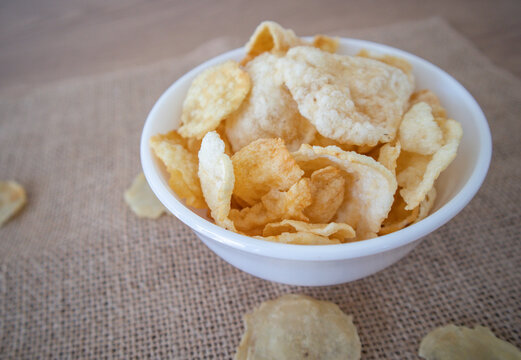 Emping is a type of Indonesian chip, a bite-size snack kripik cracker, made of melinjo or belinjo (Gnetum gnemon) nuts. Emping crackers have a slightly bitter taste