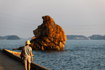 rock and tourist at the seaside