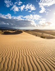 Golden desert dunes under a vibrant sky