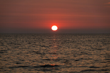 view of the sunset over the sea at the island