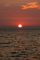 Obraz premium view of the sunset over the sea at the island