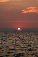 view of the sunset over the sea at the island