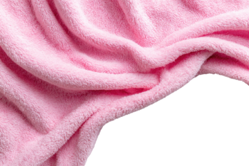 Pink fuzzy blanket draped over black background