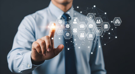 Man interacting with digital icons representing workflow apps; networking design backdrop