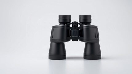 A pair of modern black binoculars for observation on a plain background