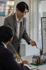 businessman is sitting working in a private office, sales promotion planning staff is writing a plan to present in a meeting, company work environment,