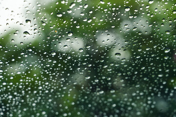 Water droplets on the glass on a natural background