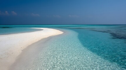 A pristine, white sand beach curves into a tranquil, turquoise lagoon.