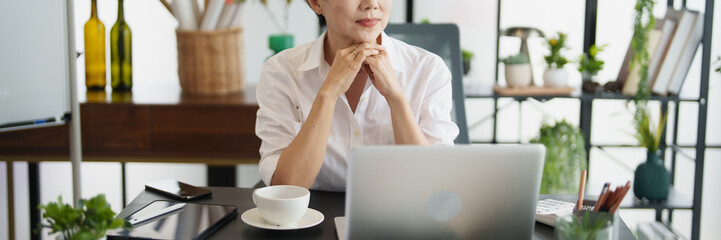 Senior business asian woman mature working in office