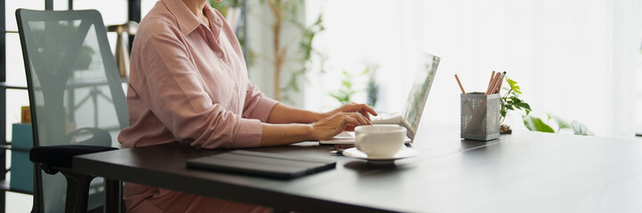 Senior business asian woman mature working in office