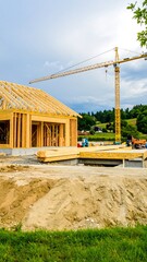 House under construction with crane