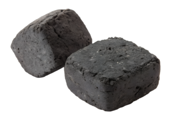 Two dark charcoal briquettes rest on a transparent background. This isolated png image displays the solid fuel carbon forms, ready for use. Transparent.