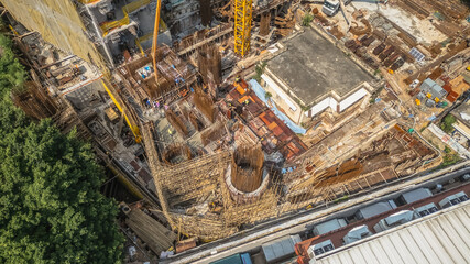 July 26 2025 Modern Construction Site With Tower Cranes and Urban Buildings