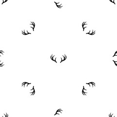 Seamless pattern of repeated black deer horns symbols. Elements are evenly spaced and some are rotated. Illustration on transparent background