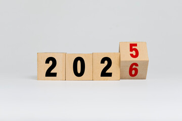 flip wooden blocks with year 2025 to 2026 isolated on white background