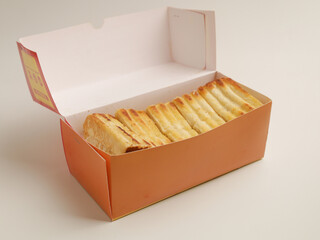 Toasted bread on wooden tray