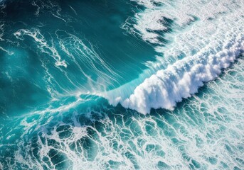 Fototapeta premium An aerial view of a powerful ocean wave crashing with white foam and turquoise water