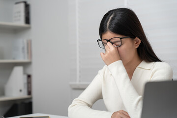 Eye problems, Asian women with tired and irritated eyes, eye rubbing, dry, eye pain after work,...