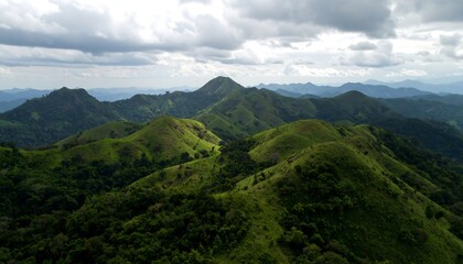 Lush green hills under cloudy sky