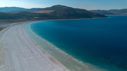 The tranquil beauty of Salda Lake - Turkey with its crystal clear turquoise waters and stunning surrounding landscapes is a mesmerizing sight to behold.