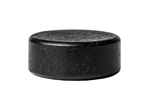 Dark, worn hockey puck, isolated on black background.  Textured, circular, and slightly angled