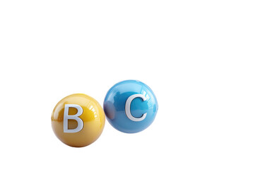 Two glossy vitamin balls, one yellow with "B" and one blue with "C