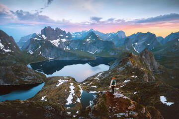 Lofoten islands sunset scenery woman traveling in Norway hiking solo active adventure vacations...