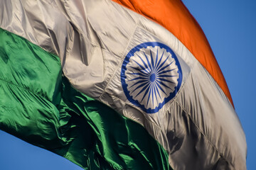 India flag flying high at Connaught Place with pride with plain white background, India flag fluttering, Indian Flag on Independence Day and Republic Day of India, tilt up shot, Har Ghar Tiranga