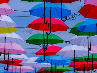 Fototapeta premium Decorative umbrellas over a street in a popular tourist spot