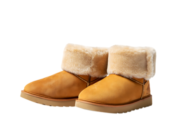 A pair of trendy tan UGG boots featuring soft fur lining and a thick sole for maximum comfort and style,Ideal for winter footwear