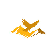 Obraz premium golden eagle soaring over mountain peaks