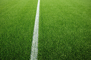 green artificial turf with a clean white line