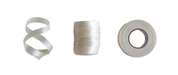 Three rolls of white, flexible material