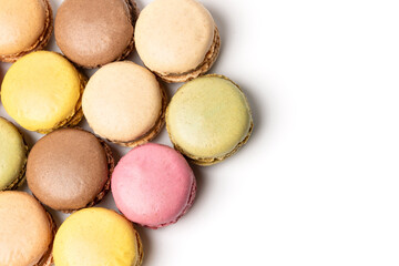 Small colorful tasty sweet original classic macaroons cakes isolated on white studio background