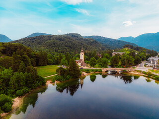 Fototapeta premium Bohinj lake in Julian Alps. Bohinj Lake, Church of St John the Baptist in Triglav National Park, Julian Alps, Slovenia