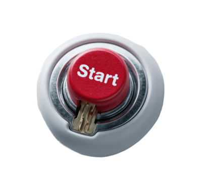 A close-up of a round, white button with a red center.  The word "Start" is printed in bold, white letters on the red disk.  A small, metallic key is visible inside the white ring