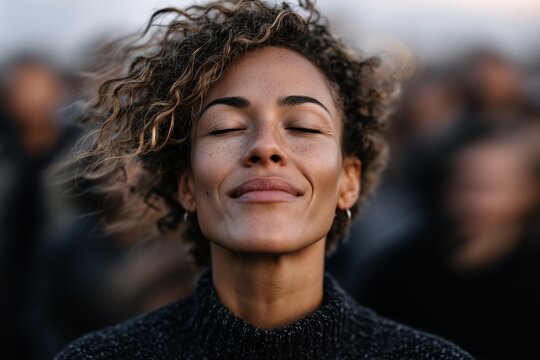 Smiling woman with closed eyes, Calm expression outdoors, Concept of peace or gratitude