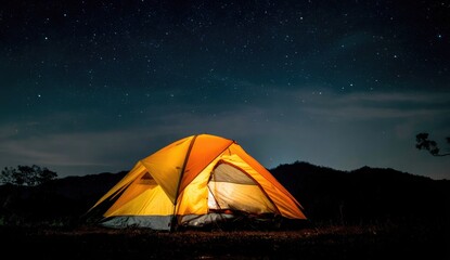 Illuminated tent under starry night sky