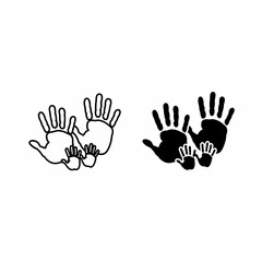 Obraz premium Two handprints, one large and one small, symbolizing family and togetherness.