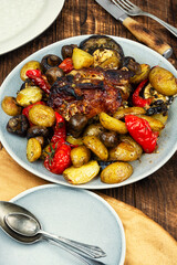 Roast pork with different vegetables.
